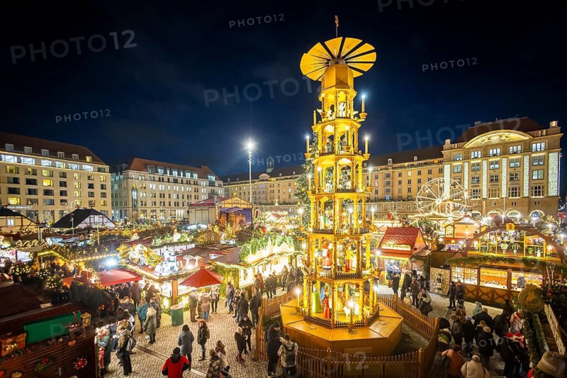 Dresden's Striezel Market has been held mostly on the Altmarkt since 1434 during Advent and attracts an average of around two million visitors a year. It is the oldest Christmas market in Germany, confirmed by a certificate. Great Ore Mountains Pyramid, Dresden, Saxony, Germany