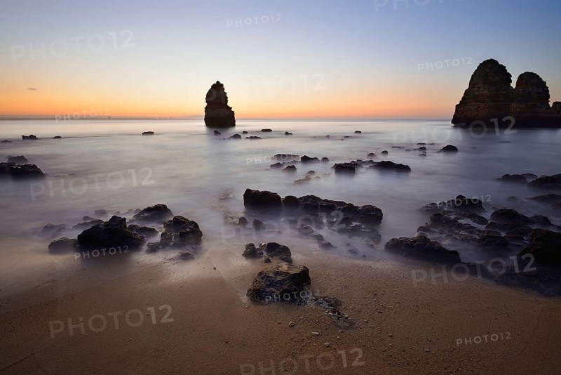 Beach and rock formations at dawn, Praia do Camilo, Lagos, Algarve, Portugal