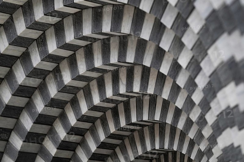 Marble and gneiss alternating in layers, round arch approach, interior, Roman Catholic church of San Giovanni Battista, built in the same place as the village church destroyed by avalanche in 1986, architect Mario Botta, Mogno, Maggia Valley, Valle Maggia, municipality of Lavizzara, Canton of Tessin, Switzerland