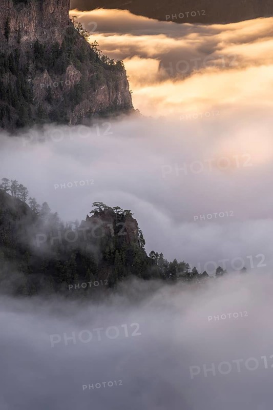 Evening clouds move into the Caldera de Taburiente and form a sea of fog at sunset. La Palma, Canary Islands, Spain