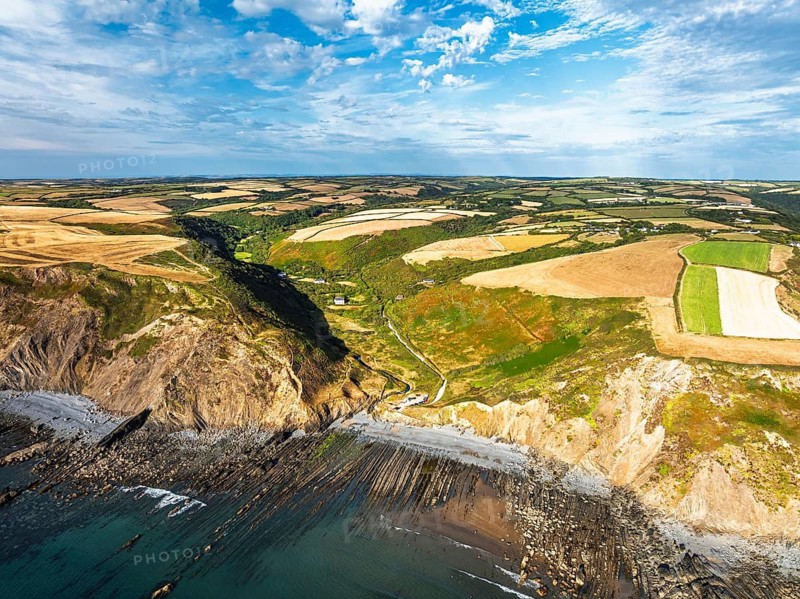 Cliffs and Fields over Welcombe Mouth Beach from a drone, North Devon and Cornwall Coastpath Border, Devon, England, Summer 2026