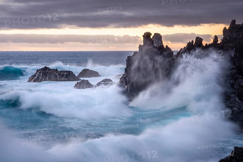 Waves break on the lava coast. In the evening. long exposure. Charco Verde, La Palma, Canary Islands, Spain