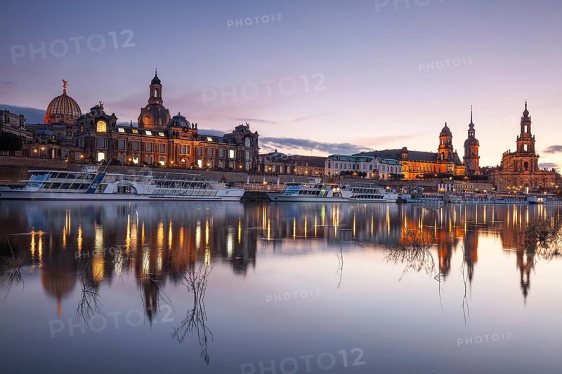 14 October 2021, Evening view of the historic skyline illuminated along the Elbe River in Dresden, Saxony, Germany