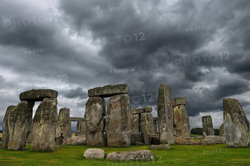 Stonehenge around 3000 BC, a megalithic structure from the Neolithic period, rain clouds, Wiltshire, southwest England, England, United Kingdom