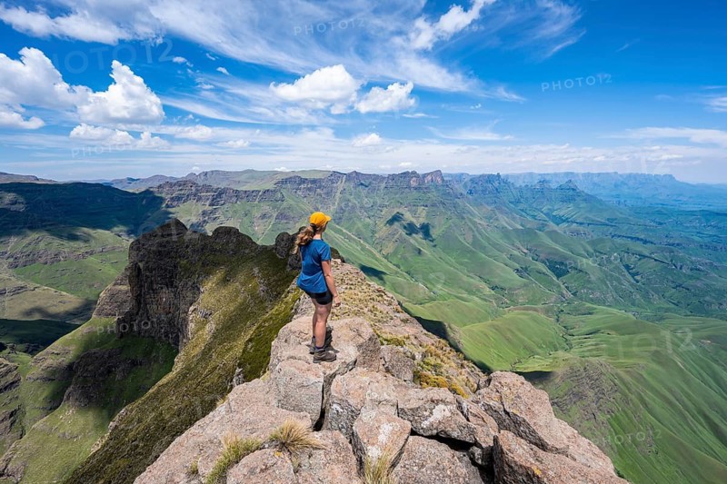 Female mountaineer at the summit of Cathedral Peak or Cathedralpiek or Mponjwana, Drakensberg, KwaZulu-Natal, South Africa