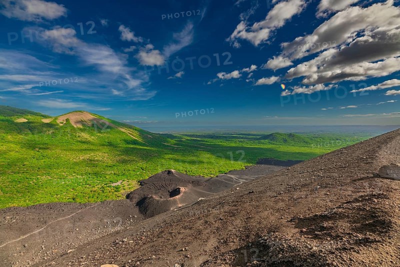 Beautiful view of the volcano, surrounded by vegetation, from Cerro Negro, Nicaragua