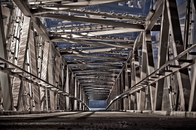 Interior of the mesh-clad Jacobs Ladder covered footbridge by artist Lisa Reihana in Auckland New Zealand