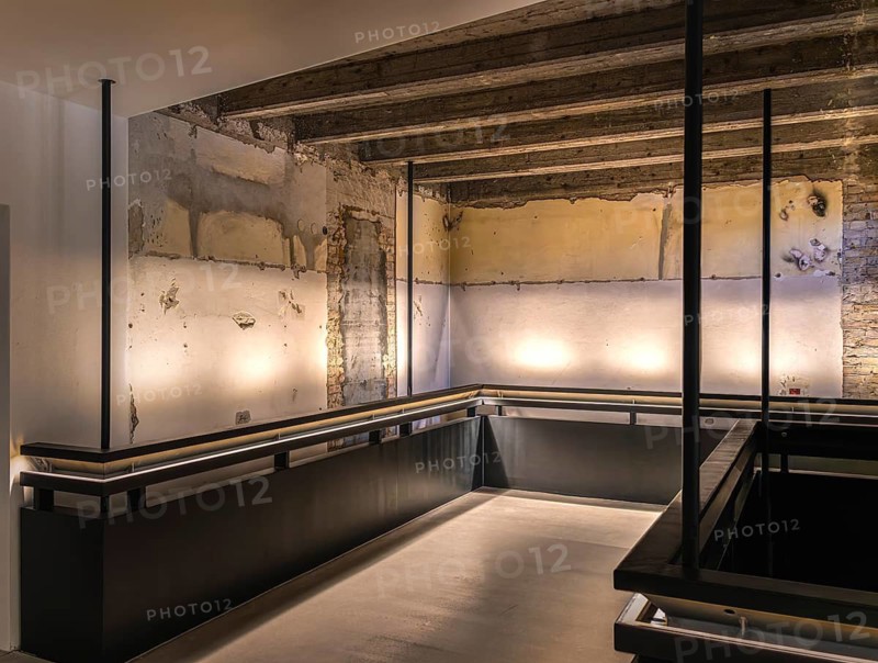 Carefully restored stairwell of the West Head Tower with newly developed steel staircase, which was installed hanging over the existing stairs while maintaining the old monumental staircase, former Tempelhof airport, Berlin, Germany