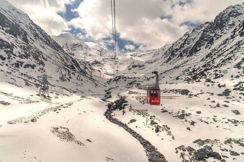 Cable car in the snowy Balea Valley to Lake Balea, Fagaras Mountains, South Carpathians, Transylvania, Romania