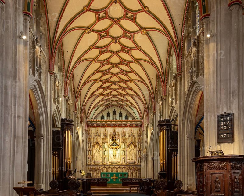 Fan-vaulted ceiling view to altar reredos, Church of Saint Mary, Ottery St Mary, Devon, England, UK