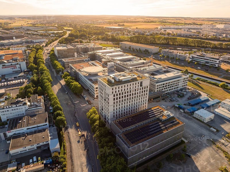 Extensive urban and industrial landscape with architectural structures and roads, construction site of the new airfield clinic, Böblingen, Germany
