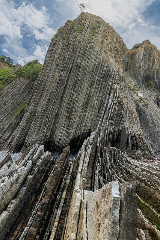 Distinctive rock cliffs as a geological formation of rock layers, Flysch on Itzurun Beach in Zumaia, Spain
