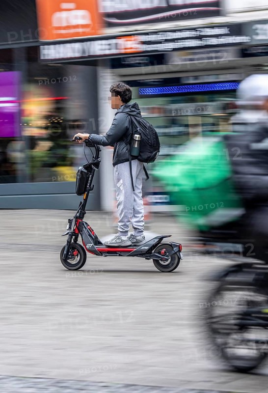 E-scooter in downtown Essen, driving in the Kettwiger Straße pedestrian zone, North Rhine-Westphalia, Germany, private scooter