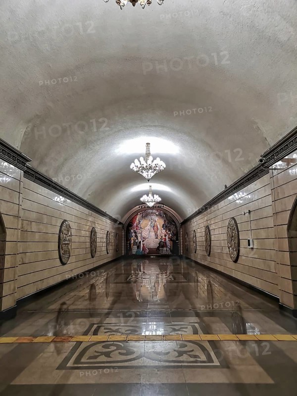 ALMATY, KAZAKHSTAN, NOVEMBER 8, 2019: Auezov Theater Almaty Metro subway Station, Elegant subway station with chandeliers, arched ceilings, a large mural, and reflective tiled floors, Almaty, Kazakhstan