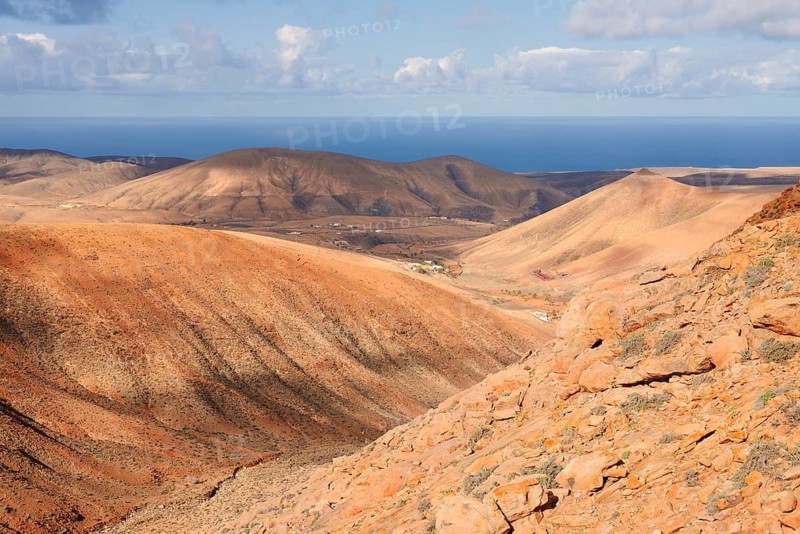 View of the barren and eroded landscape from the Mirador Risco de las Penas viewpoint, Fuerteventura, Canary Islands, Spain