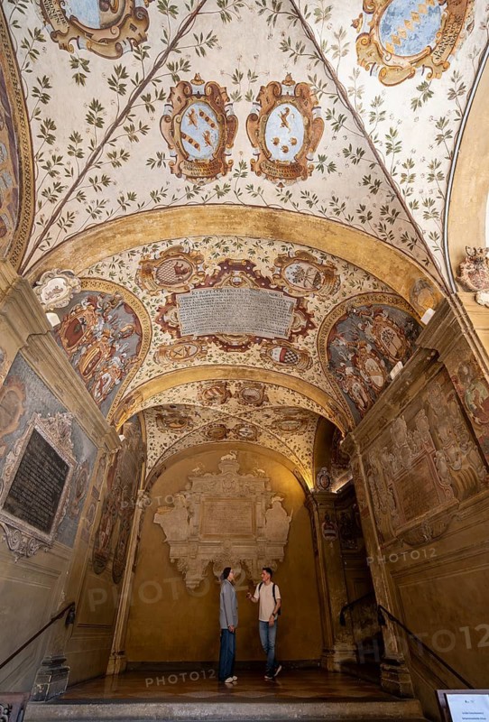 Arcades with ceiling paintings in the courtyard of the Palazzo dell'Archiginnasio, historic former university building, old town, Bologna, Emilia Romagna, Italy