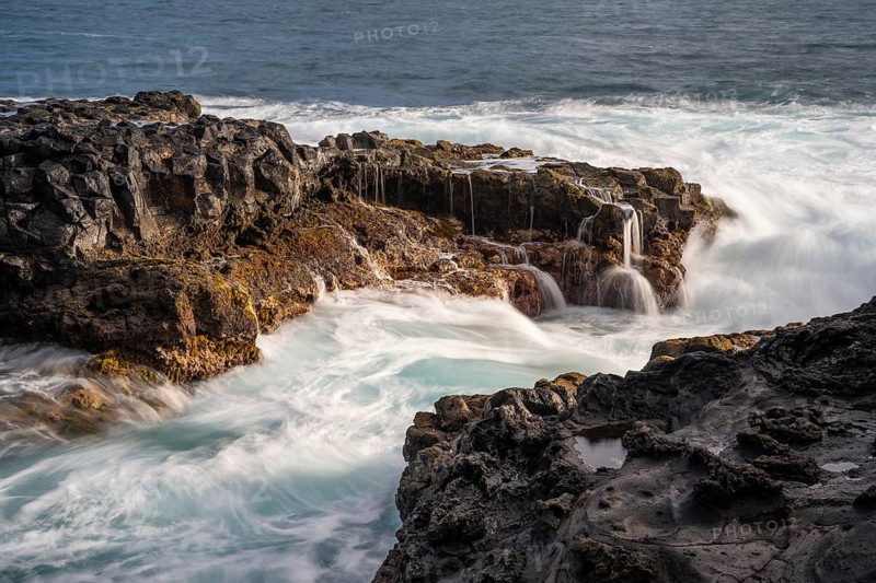 Sea and lava rocks. Long exposure, coast near Puerto de Talavera, La Palma, Canary Islands, Spain