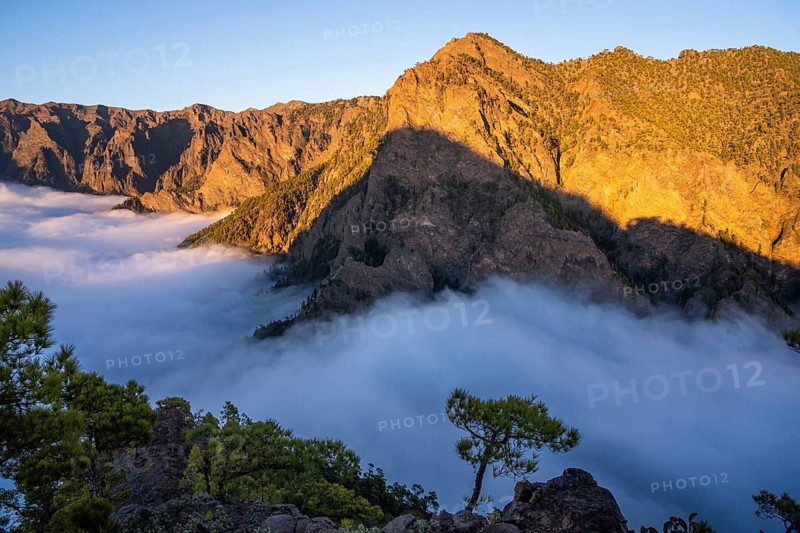 View of the Caldera de Taburiente at the golden hour. Sea of fog in the caldera. La Palma, Canary Islands, Spain