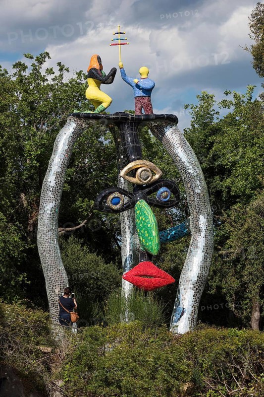 Face, colorful sculpture, Giardino dei Tarocchi or Garden of Tarot, by Niki de Saint Phalle and Jean Tinguely, near Capalbio, Grosseto Province, Tuscany, Italy
