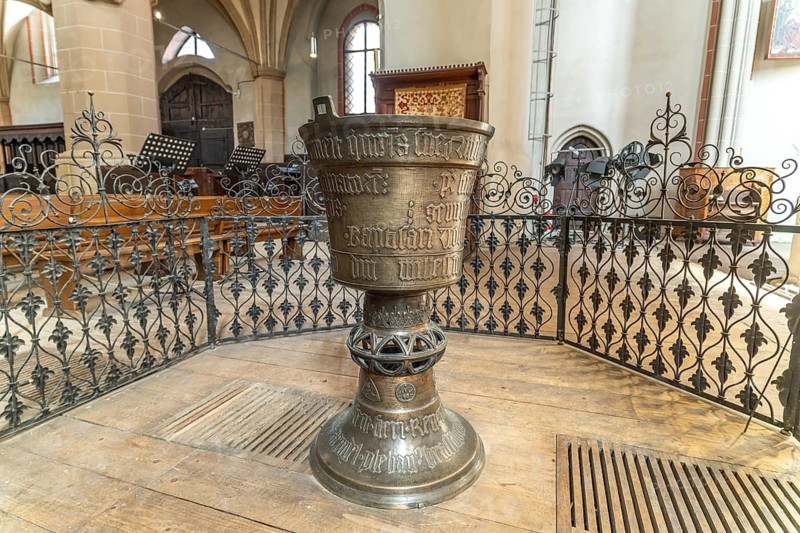 The Gothic baptismal font in the interior of the Black Church in Brasov or Kronstadt, Transylvania, Romania