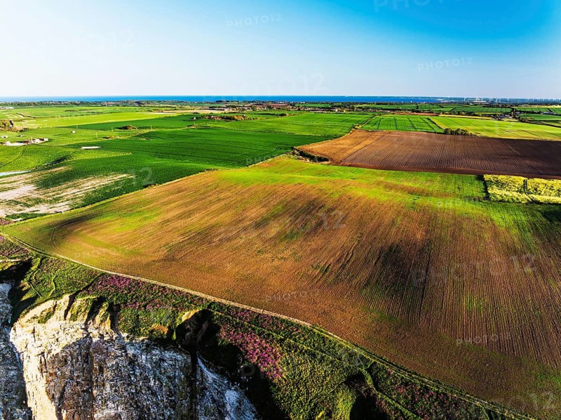 Farm and Fields over Bempton Cliffs from a drone, Yorkshire, England, United Kingdom