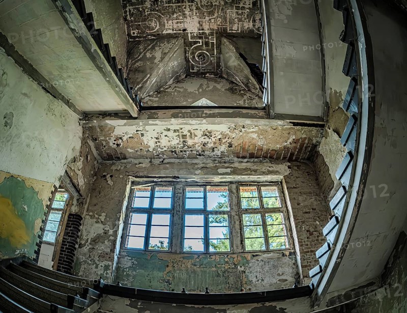 Mysterious bare staircase in a building in the complex of the former Pulmonary Hospital and Lost Place Heilstätte Grabowsee, Oranienburg, Brandenburg, Germany