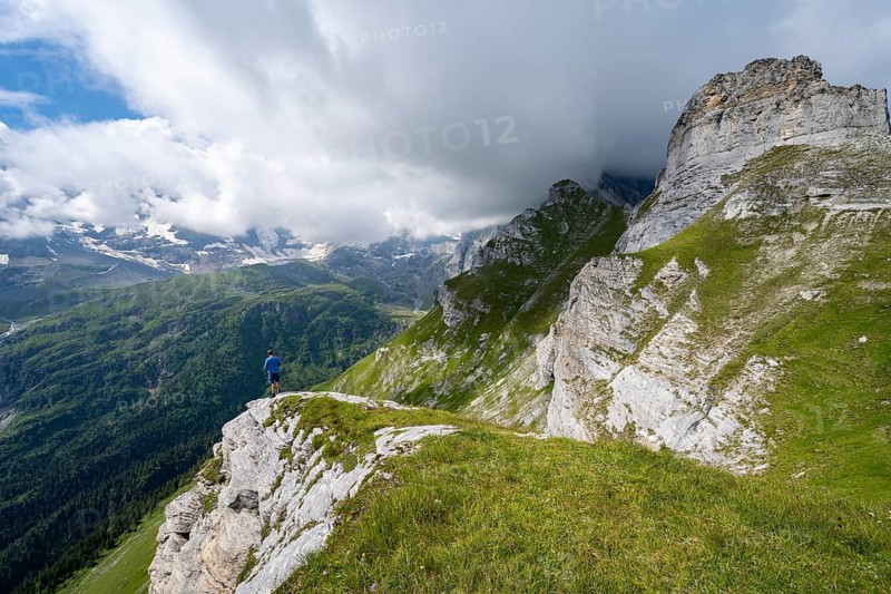 Mountaineers in front of picturesque mountain scenery at the summit of Tanzbödeli, mountain landscape with Breithorn and Tschingelhorn peaks, Bernese Alps, Bernese Oberland, Switzerland