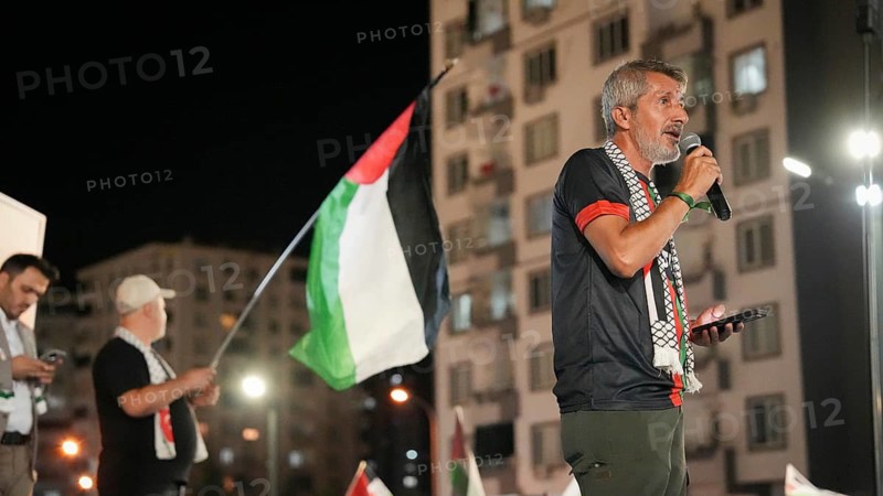 Gaziantep, Turkey - August 06, 2026: Participants of the Palestine Convoy, which set off from Sarajevo, Bosnia and Herzegovina, gather alongside local residents in Gaziantep while waving Palestinian flags to draw global attention to ongoing Israeli attacks on Gaza and the humanitarian crisis in Palestine, Gaziantep, Turkey