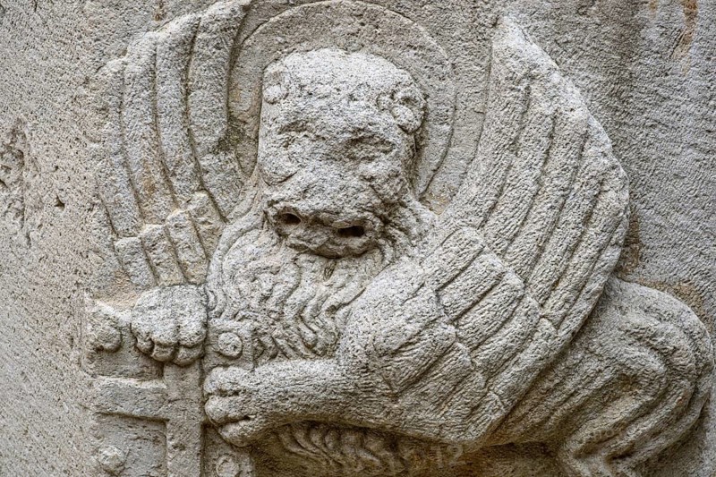 A carving of Saint Mark's winged lion, a Venetian symbol, dated 1475, on a well in the old town, Hvar Island, Croatia