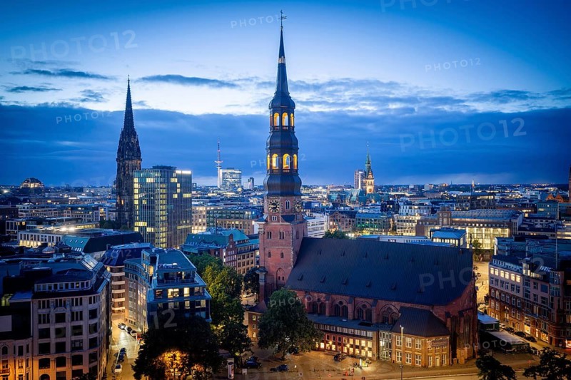 View of St. Katharinen Main Church, St. Nikolai, City Hall and Michel over Hamburg city center at Blue Hour, Hamburg, Germany