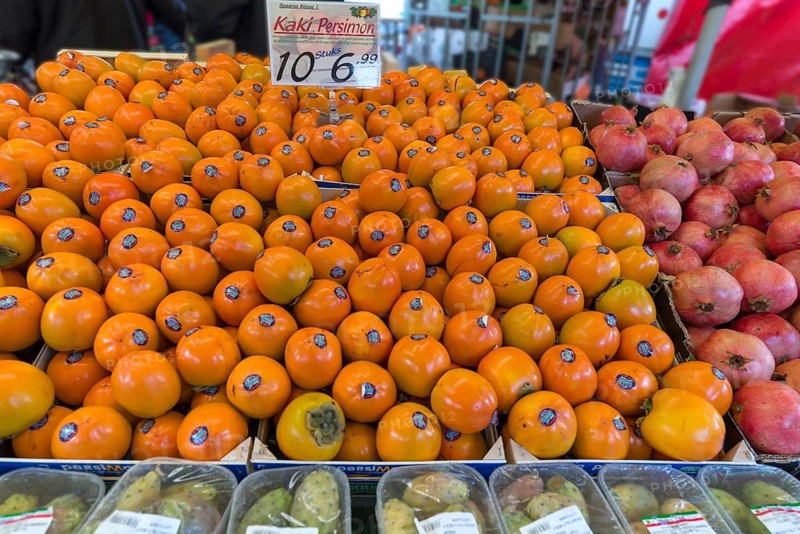 Persimmons (Diospyros kaki) at a weekly market market, the Netherlands