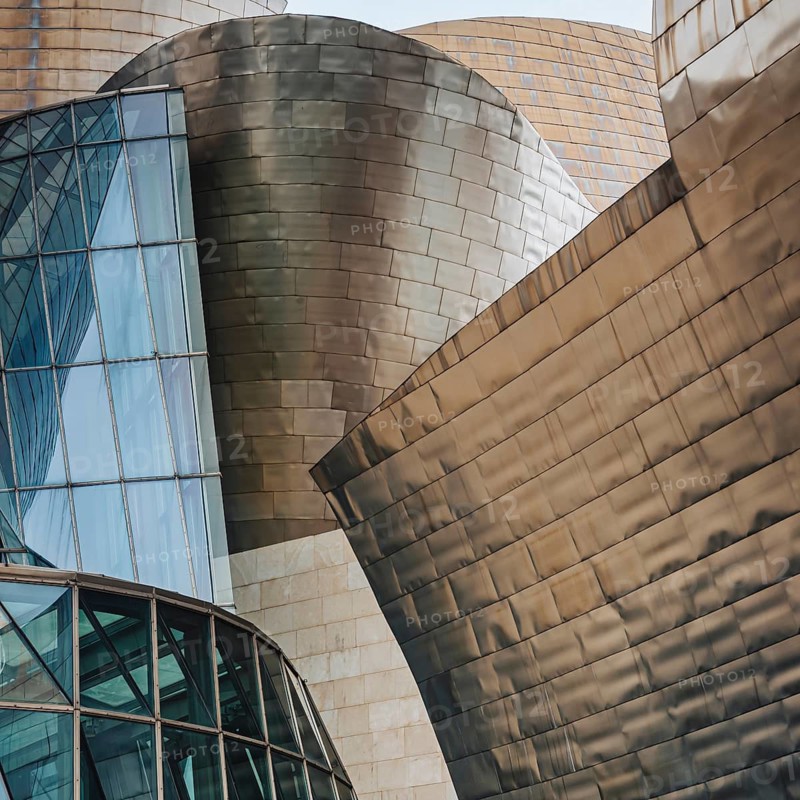 Exterior view of the Guggenheim Museum with titanium plates and glass elements in Bilbao, Spain