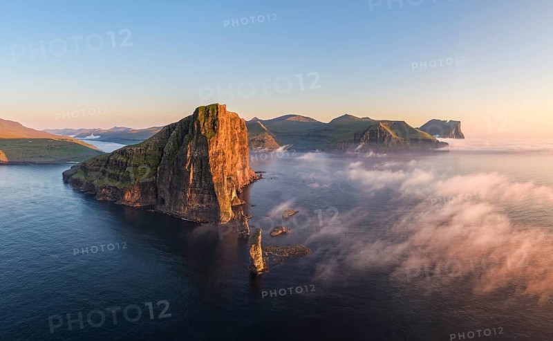 The Risin og Kellingin pinnacles off the Eysturoy cliffs in the evening light, Faroe Islands, Denmark