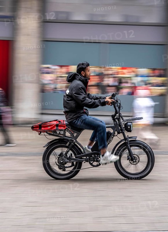 City center, shopping street, Kettwiger Straße pedestrian zone in Essen, bicycle courier of a delivery service on an e-fat bike, North Rhine-Westphalia, Germany, rental scooter, rental scooter
