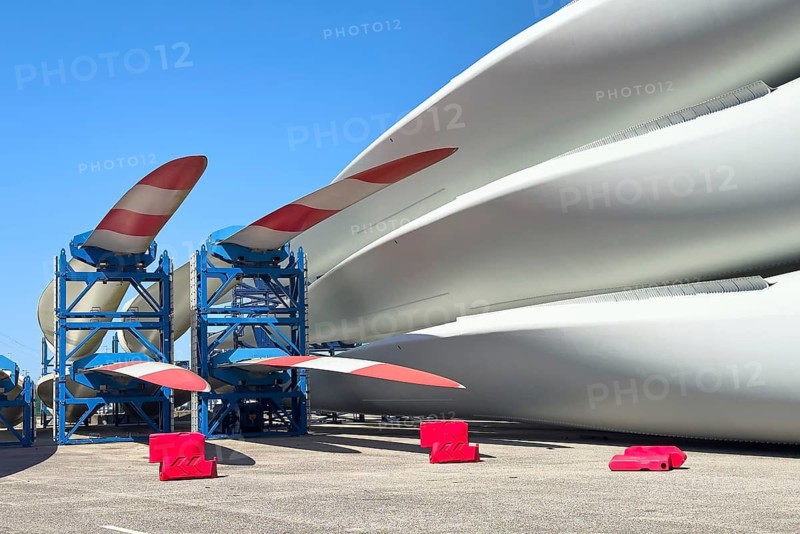 Wind turbine blades stored at a harbor, ready for shipping and assembly as part of renewable energy infrastructure, Aveiro, Portugal