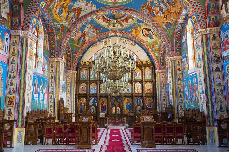 Lavishly painted religious room with icons and frescoes on the walls and ceiling of an Orthodox church, interior of the Nativity of the Blessed Virgin Mary Church, Happy Cemetery, Cimitirul Vesel, Sapân?a, Sapanta, Maramure?, Maramures, Maramures, Romania