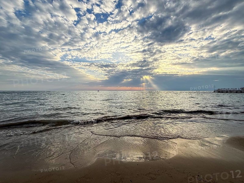 Tranquil sunset over sea with dramatic clouds and soft waves, Side, Manavgat, Antalya Province, Turkey