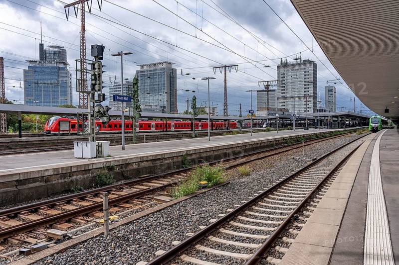 Regional train in Essen main station, downtown skyline, high-rise office buildings, North Rhine-Westphalia, Germany