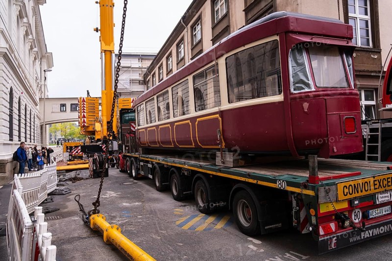 An old suspension railway wagon is lifted with a truck-mounted crane into an intermediate building at Wuppertal Central Station, Wuppertal, Germany