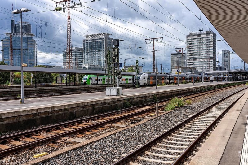Public transport, S-Bahn, in Essen main station, city skyline, high-rise office buildings, North Rhine-Westphalia, Germany