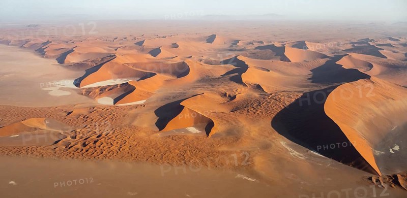 Aerial view of salt pans and red sand dunes of the Namib Desert, Namib Naukluft Park, Namibia