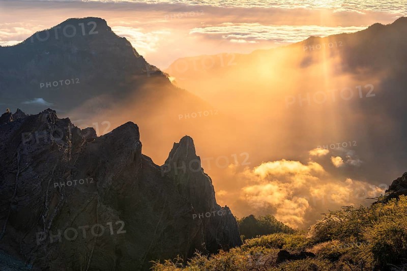 View of the Caldera de Taburiente from Pico de La Nieve at sunset and back light. In the back left, Mount Bejenado. La Palma, Canary Islands, Spain