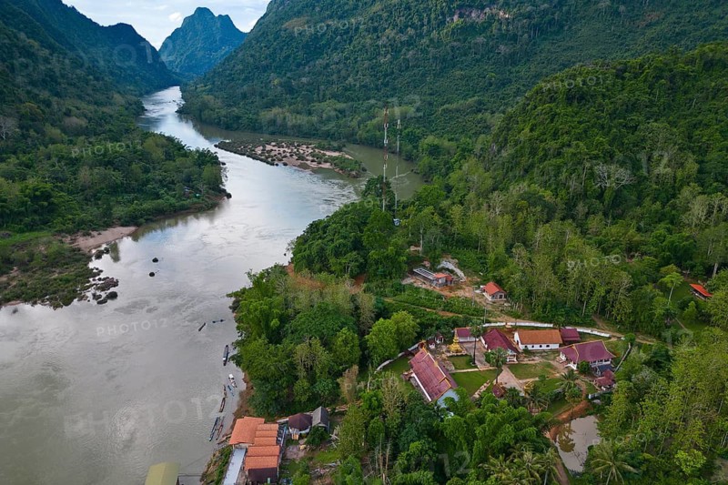 Aerial view, mountain landscape with Buddhist monastery on the banks of the Nam Ou River, Muang Ngoi Neua, Northern Laos, Louangphrabang Province, Laos