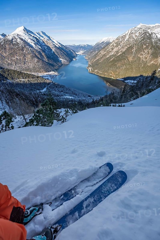 Skiing in snow, picturesque view of Lake Achensee and winter mountain scenery, Bärenkopf, Achensee, Tyrol, Austria