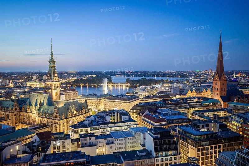 View of Hamburg city center with city hall, Inner Alster and main church of St. Peter at the Blue Hour, Hamburg, Germany
