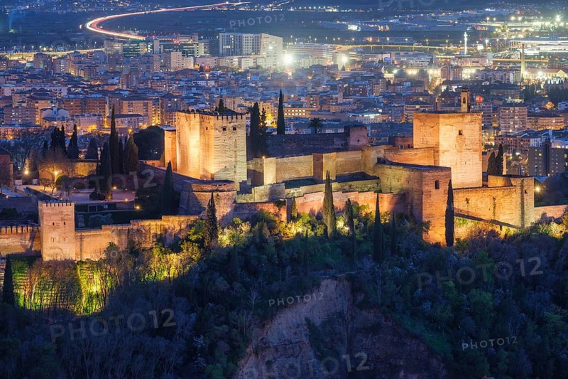 High view of Alhambra historic fortress in Granada, Spain, showing alhambra palace, fortress complex, and moorish architecture