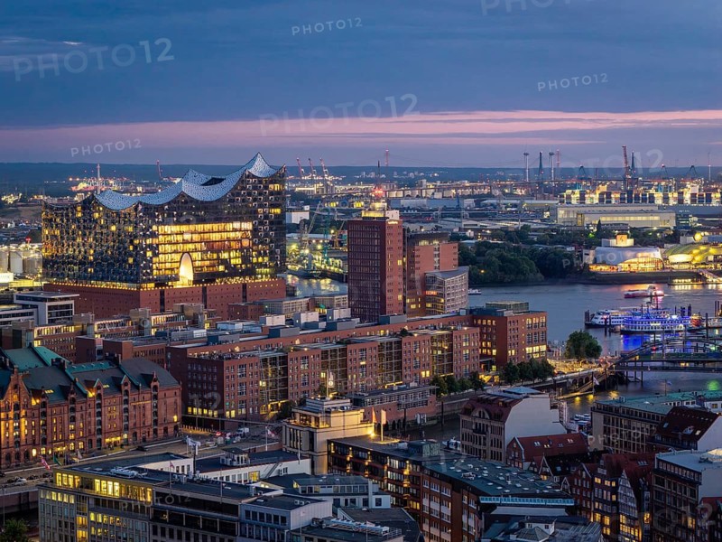 View of the illuminated Elbe Philharmonic Hall, HafenCity and the Port of Hamburg at the Blue Hour, Hamburg, Germany