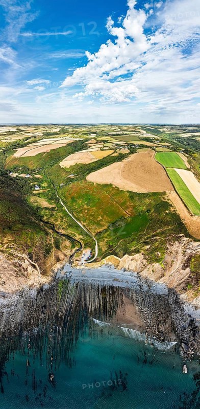 Cliffs and Farms over North Devon and Cornwall Coastpath Border from a drone, Welcombe Mouth Beach, Devon, Cornwall, England, Summer 2026