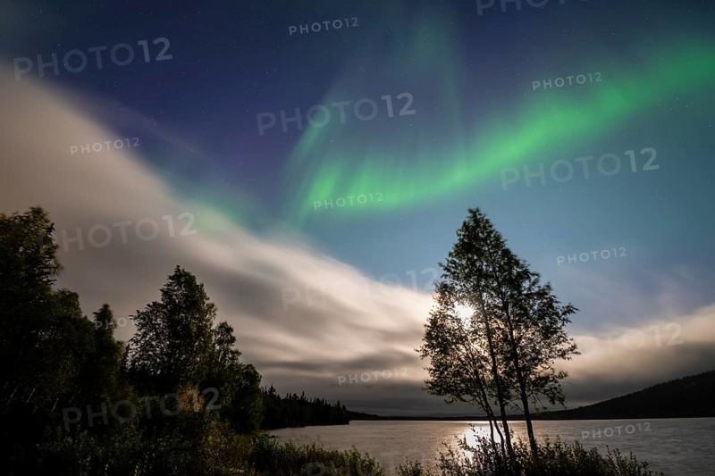 The Northern Lights (Aurora borealis) over a lake in the moonlight, Gällivare, Norrbotten, Lapland, Sweden, August 2026