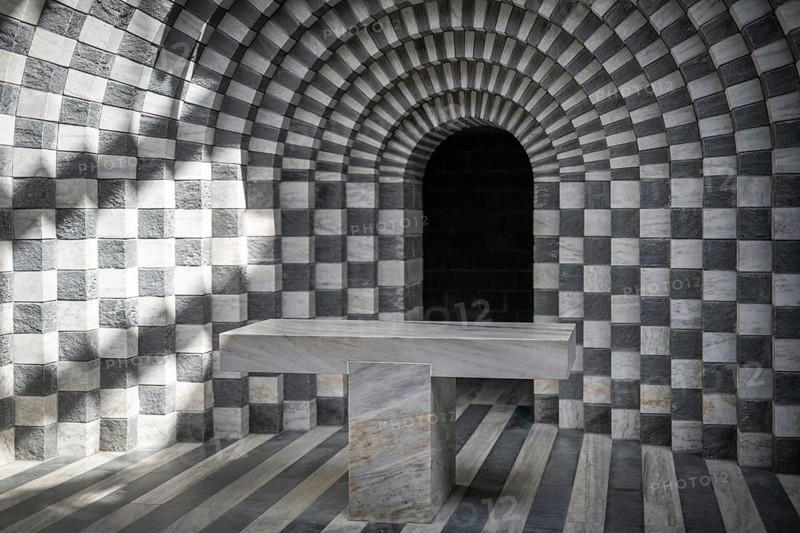 Altar in front of round arch, interior, Roman Catholic church of San Giovanni Battista, built in the same place as the village church destroyed by avalanche in 1986, architect Mario Botta, Mogno, Maggia Valley, Valle Maggia, municipality of Lavizzara, Canton of Tessin, Switzerland